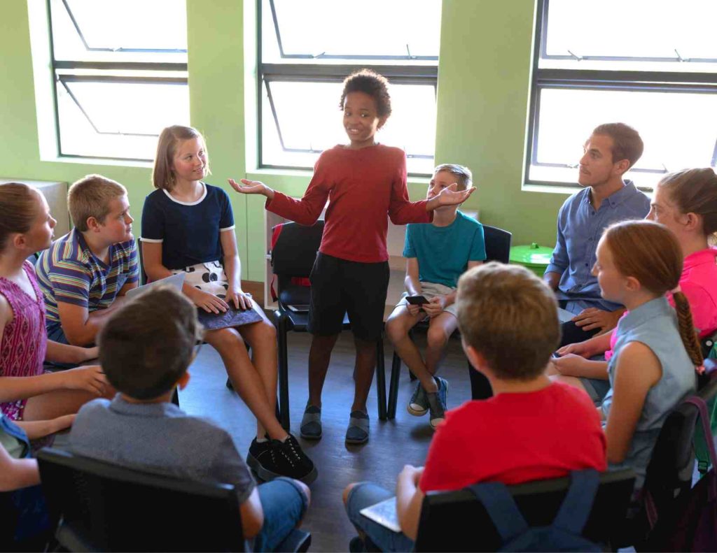 students in morning meeting to build positive relationships